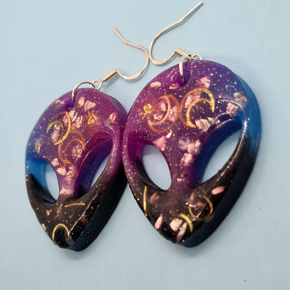 Cosmic Steve moon earrings. Pink glass and gold moon embellishment. Glow in the dark. - Strawberry Moon Jewellery 